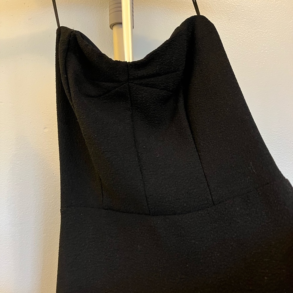 Zara strappless black mini dress with different cuts that remark your figure.